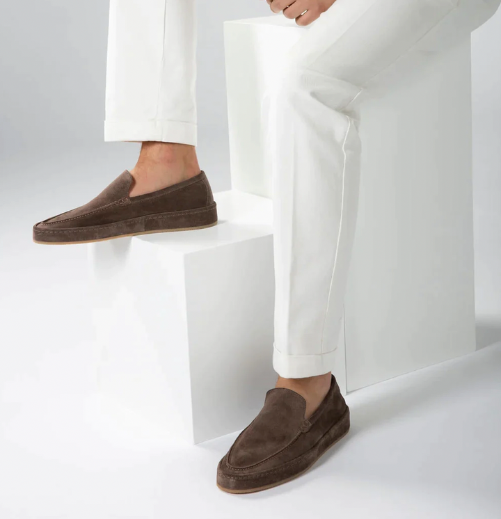 Stylish men's navy blue loafers, elegant slip-on shoes for smart casual attire.