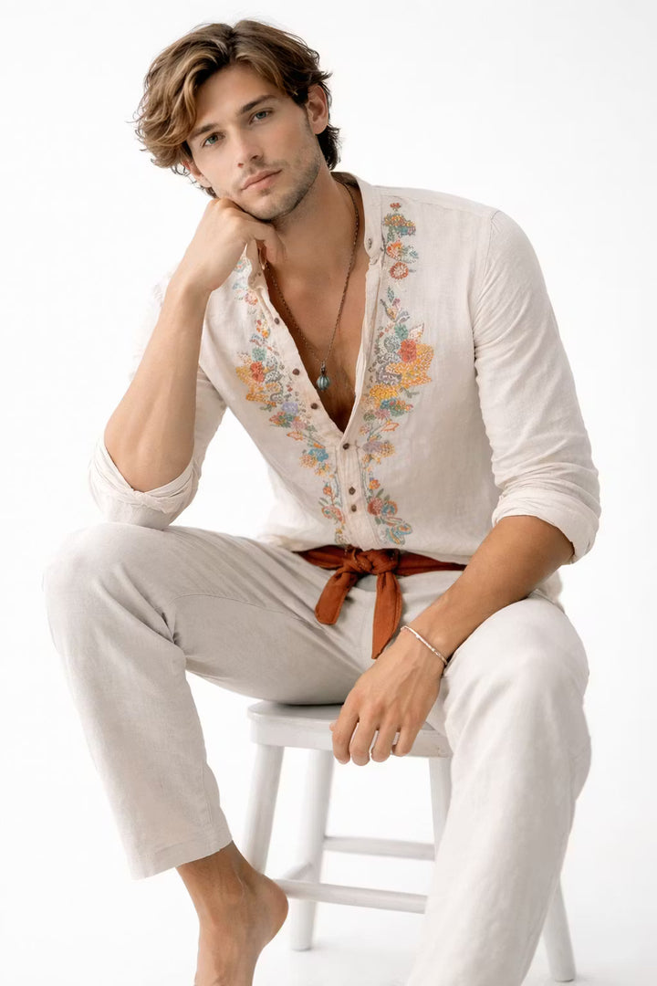 Stylish men's long-sleeve V-neck shirt featuring intricate floral embroidery, great for smart casual.