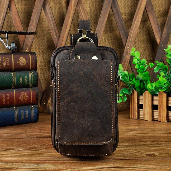 Rugged men's genuine leather waist pack in dark brown, vintage style belt bag for everyday accessories.