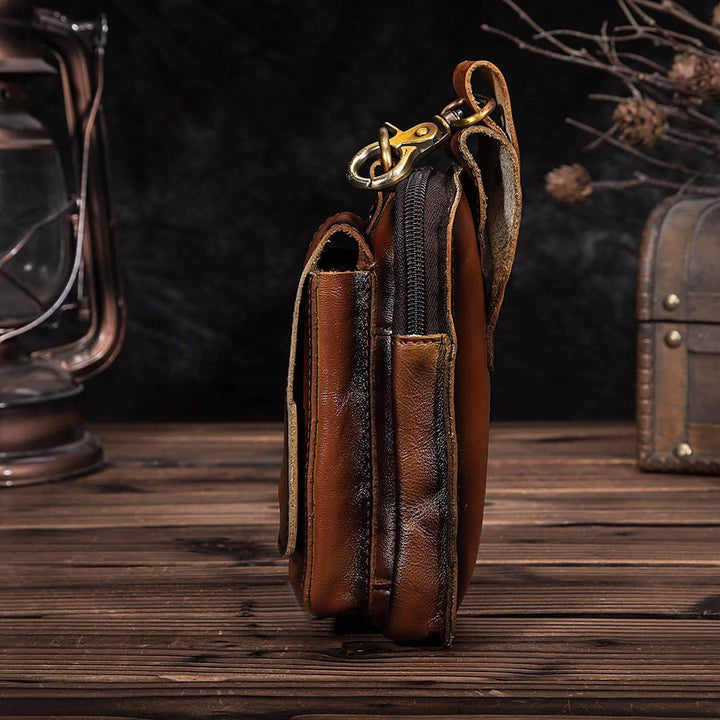 Close-up of a men's dark brown genuine leather waist pack, showcasing fine texture and detailed stitching.