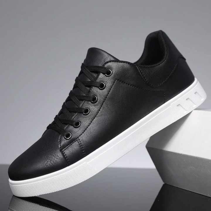 Stylish men's low-top casual sneakers with white sole, perfect for modern everyday wear.