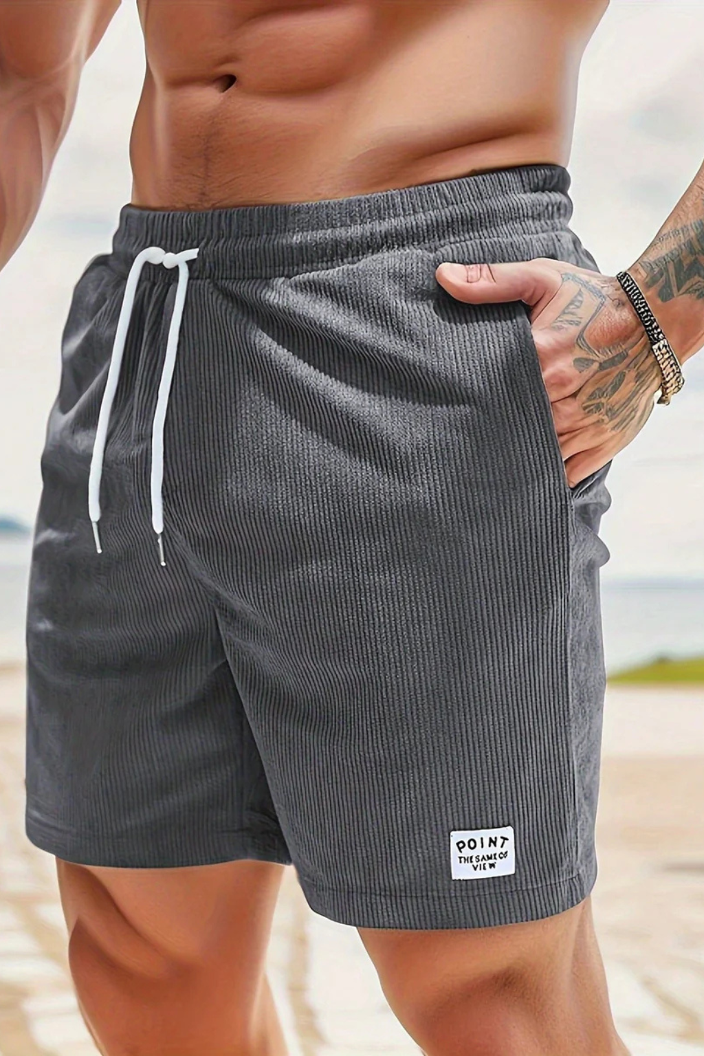 Men's tailored pleated shorts, high waist with subtle stripes and a turn-up hem.