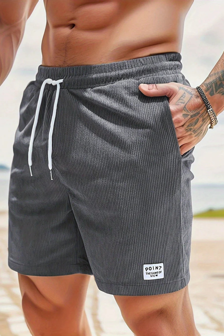 Men's tailored pleated shorts, high waist with subtle stripes and a turn-up hem.