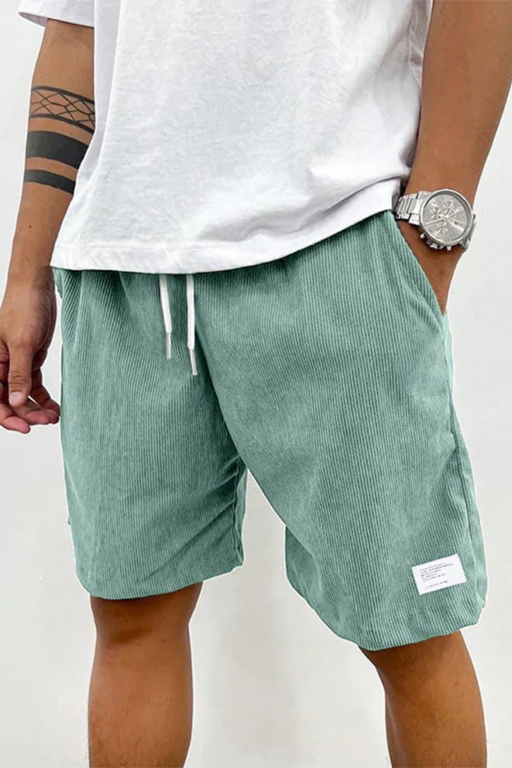 Versatile men's fashion: high waist, striped, pleated chino shorts for casual wear.
