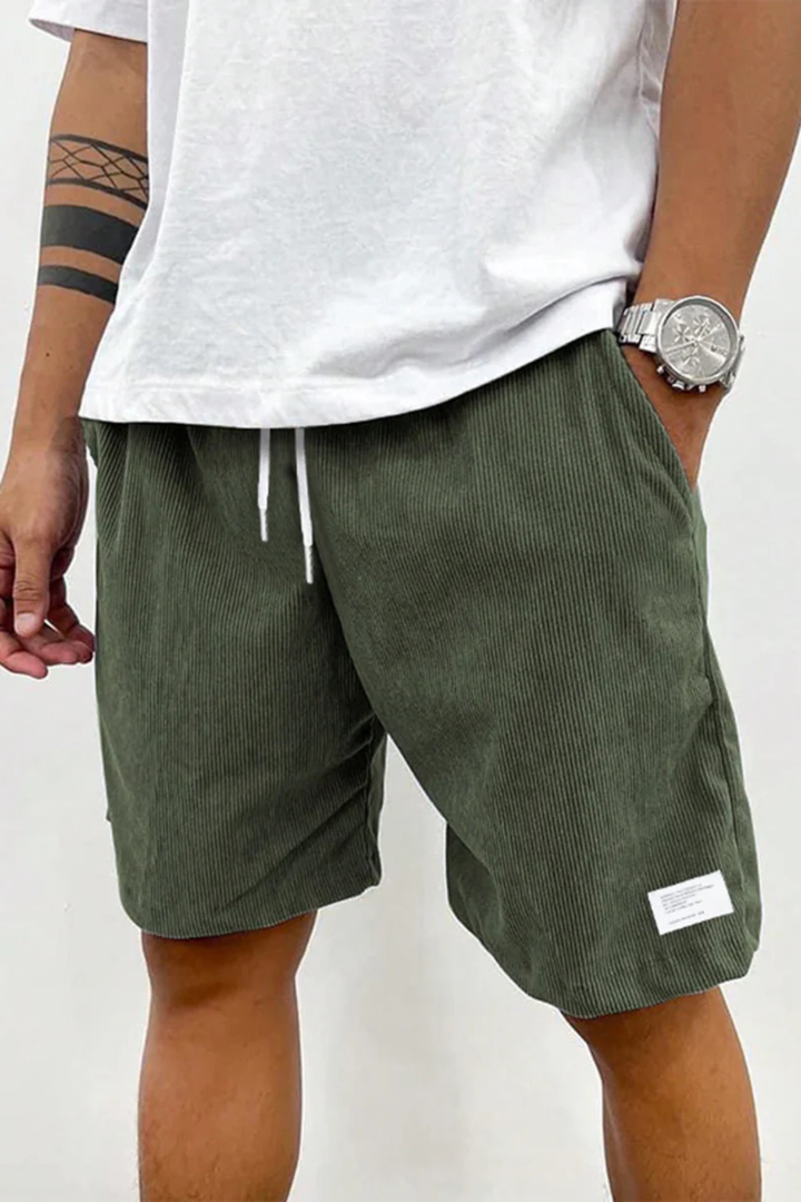 Stylish men's pleated chino shorts with a high waist and classic stripes, above knee fit.