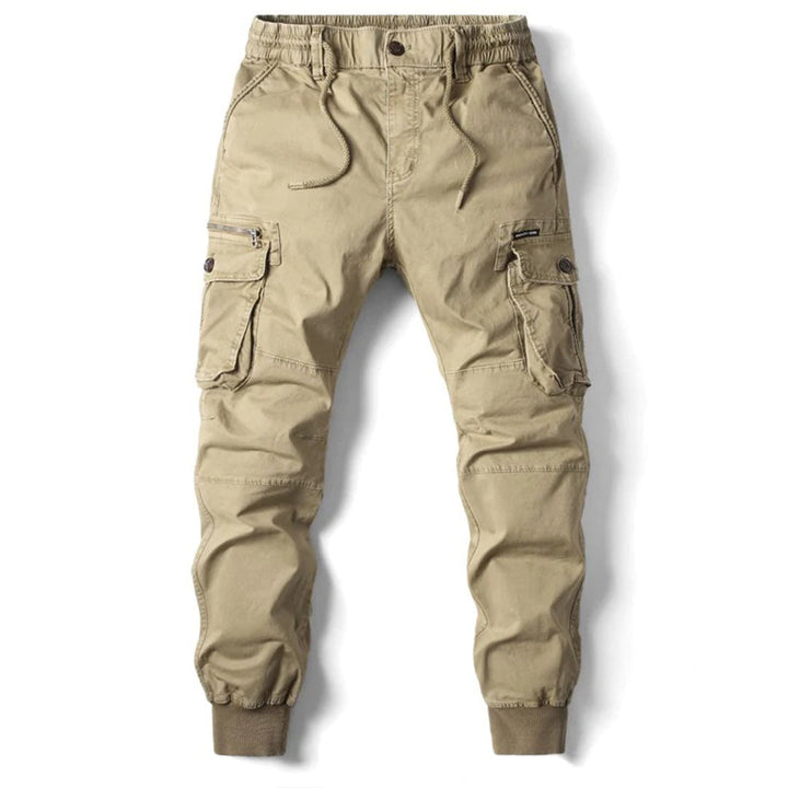 Light grey men's stretch fit utility cargo pants, tapered leg, versatile for casual or outdoor adventures.