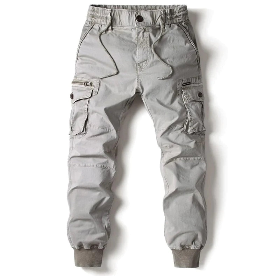 Green tapered men's cargo pants, stretch fit, durable for active outdoor and casual use.