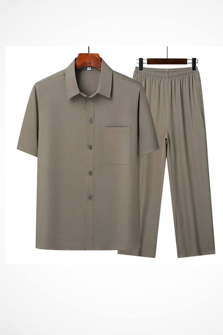 Close-up of men's lapel short sleeve button shirt, part of a trendy casual trouser set.