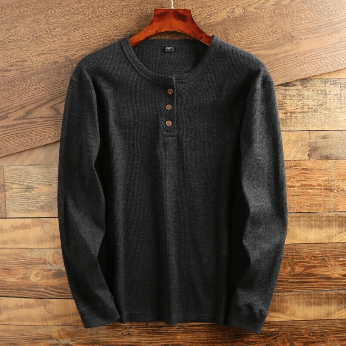 Men's casual long sleeve Henley with classic button placket & textured waffle knit design.