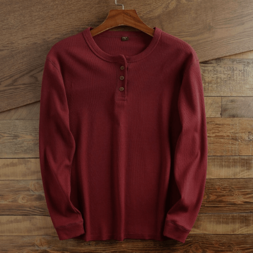 Modern men's long sleeve waffle knit Henley, a versatile textured everyday casual top.