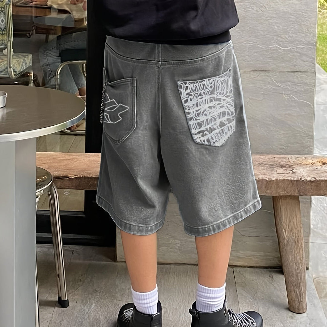 Stylish men's loose fit denim Bermuda shorts with intricate floral embroidery. Casual summer wear.