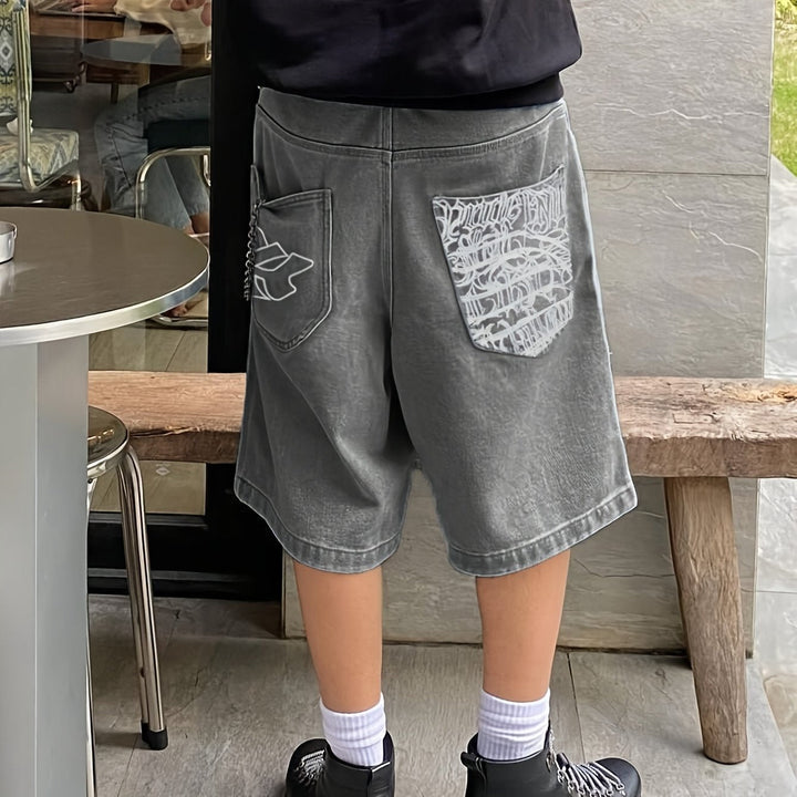 Stylish men's loose fit denim Bermuda shorts with intricate floral embroidery. Casual summer wear.