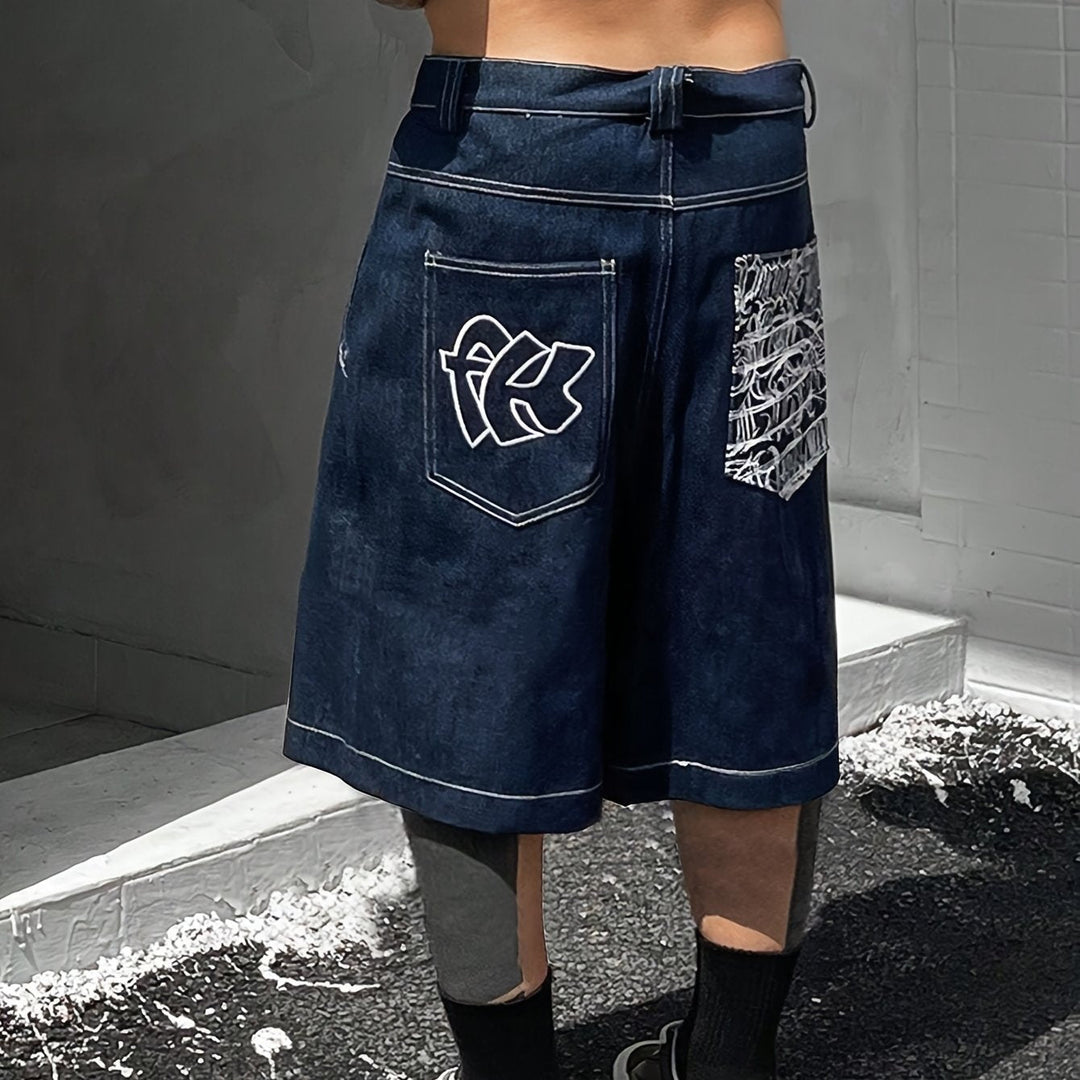 Men's loose fit denim Bermuda shorts with stunning floral embroidery. Ideal for casual summer fashion.