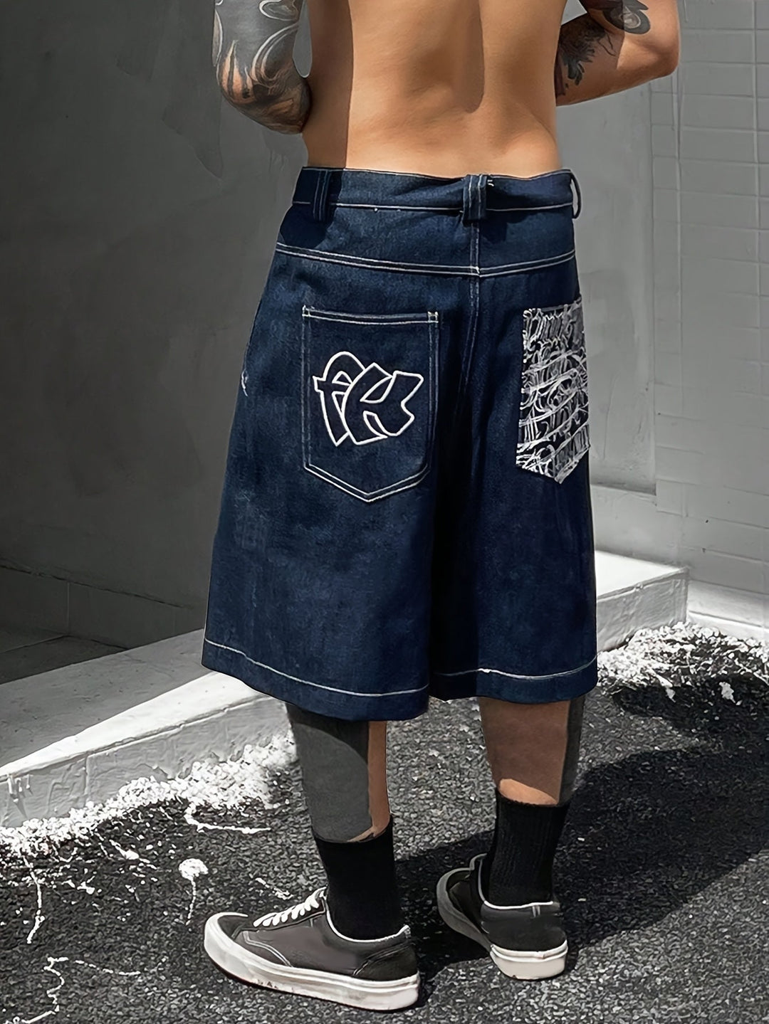 Embroidered floral men's loose fit denim shorts. Comfortable Bermuda style for summer fashion.