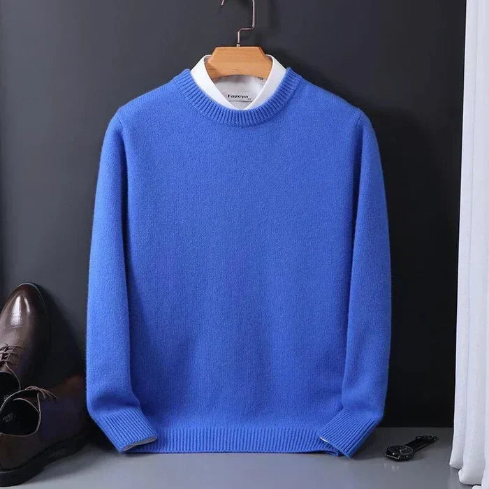 Man wearing a comfortable loose fit men's sweater, perfect timeless knitwear for relaxed winter casual style.