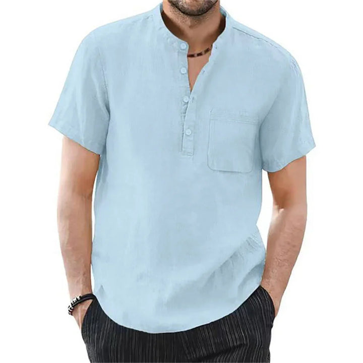 Black men's short sleeve button-down shirt with a band collar. Versatile for warm weather style.