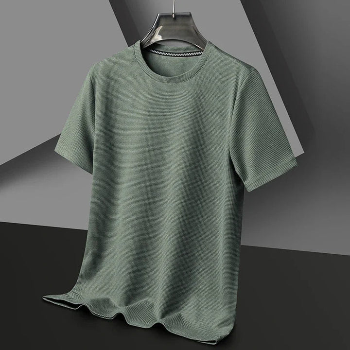 Man wearing a comfortable men's waffle crew neck t-shirt, ideal for everyday casual wear. Relaxed fit, short sleeve.