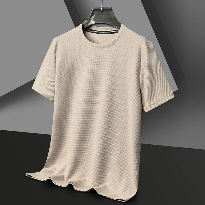 Relaxed fit men's waffle crew neck t-shirt in a modern design. Short sleeve, comfortable and versatile for summer fashion.