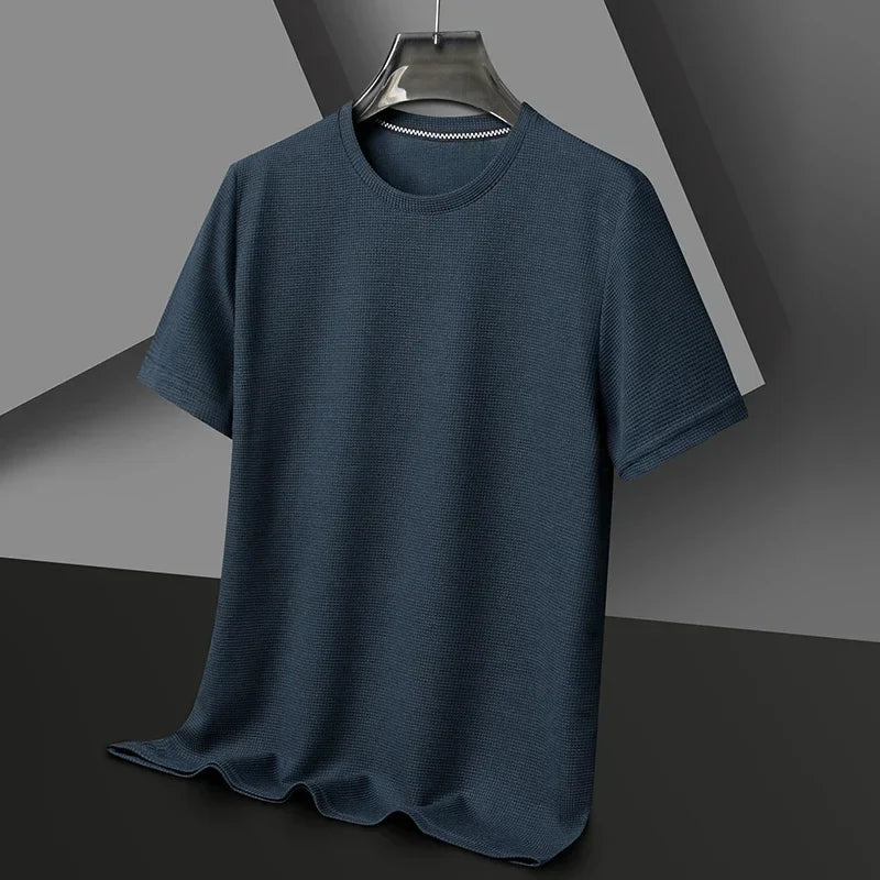 Back view of a comfortable men's waffle crew neck t-shirt, featuring a relaxed fit. Short sleeve, modern casual style.