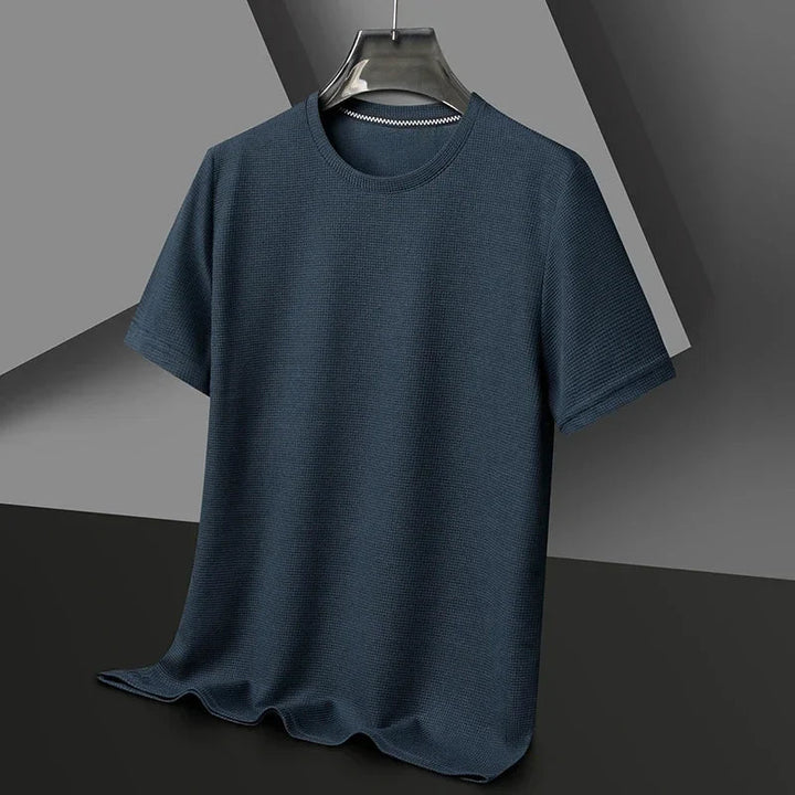 Back view of a comfortable men's waffle crew neck t-shirt, featuring a relaxed fit. Short sleeve, modern casual style.