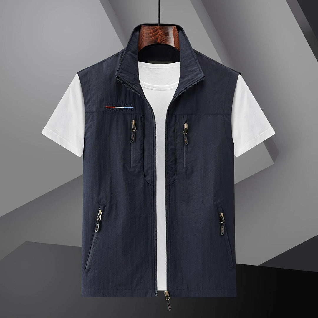 Men's multi-pocket utility vest for summer travel. Breathable & sleeveless design for outdoor adventures.
