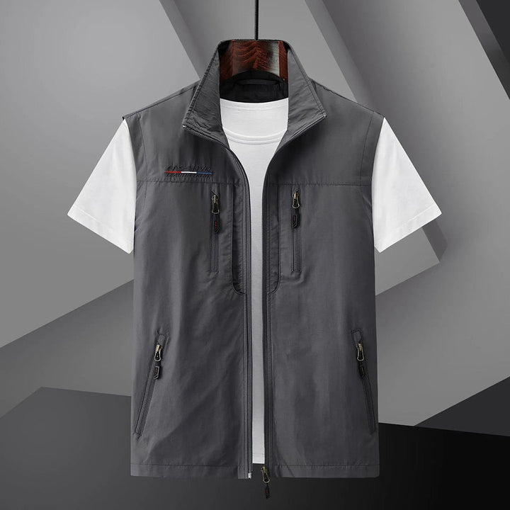 Breathable men's summer utility vest with multiple pockets for travel and outdoor activities.