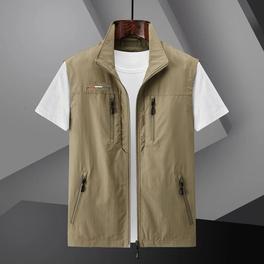Men's outdoor utility vest. Multi-pocket design for fishing, hiking & summer travel gear. Sleeveless.