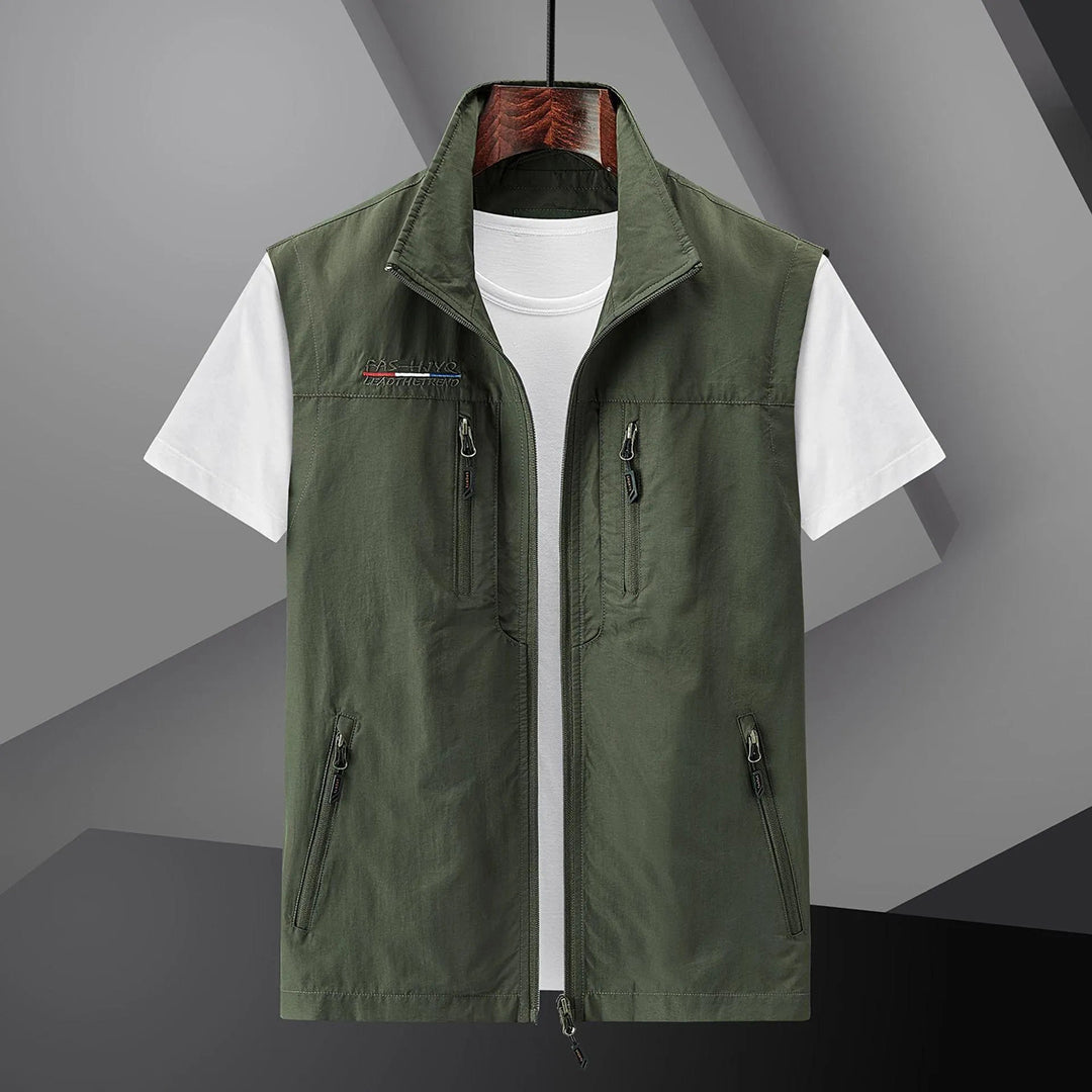 Stylish men's travel vest. Multi-pocket, breathable, and sleeveless for summer outdoor adventures.