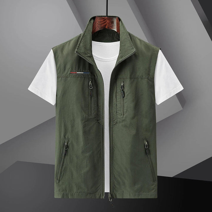 Stylish men's travel vest. Multi-pocket, breathable, and sleeveless for summer outdoor adventures.
