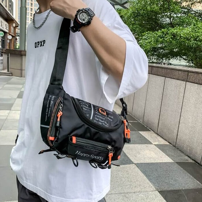 Man wearing water-resistant sling bag as crossbody. Multi-way travel & outdoor utility pack. Durable nylon.