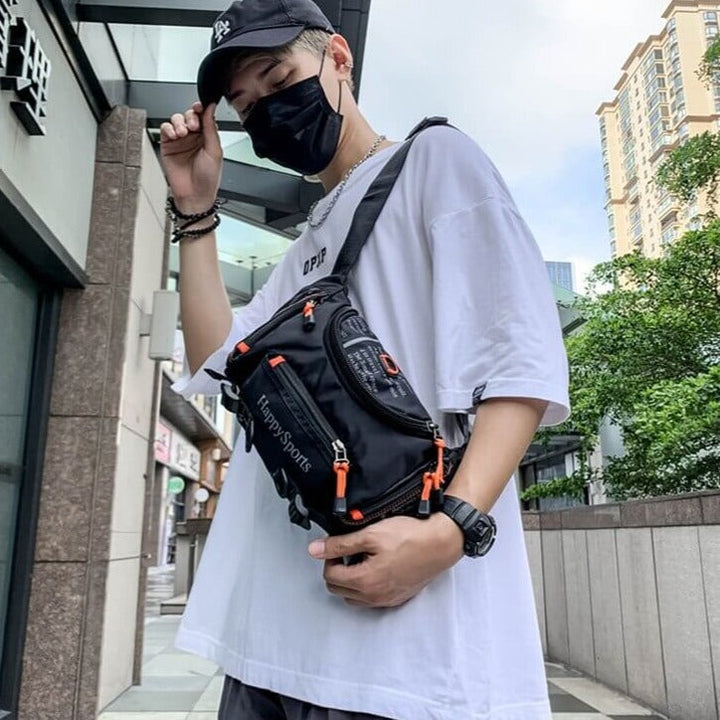 Active men's water-resistant sling bag for outdoor sports. Multi-way travel utility pack, crossbody or waist style.