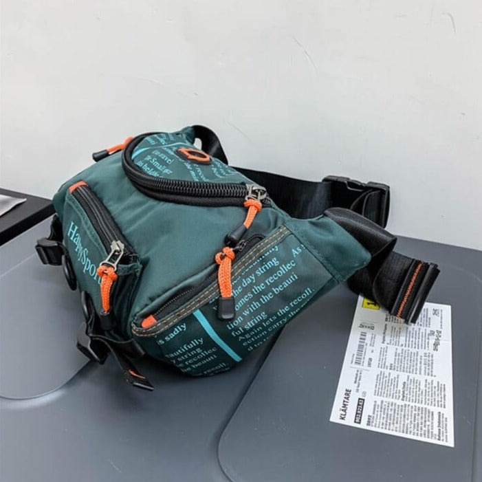 Side view: Men's water-resistant sling bag, showing compact design. Multi-way travel & outdoor utility. Nylon.