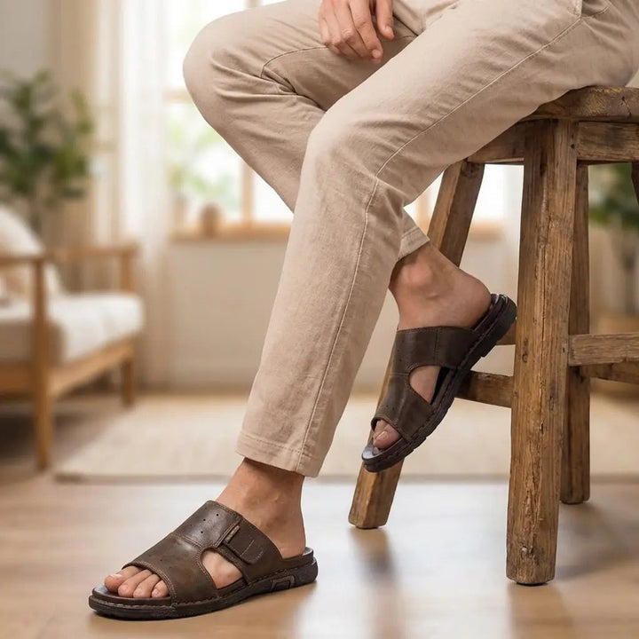 Comfortable men's wide-fit slide sandals with orthopedic design for foot support & daily wear.