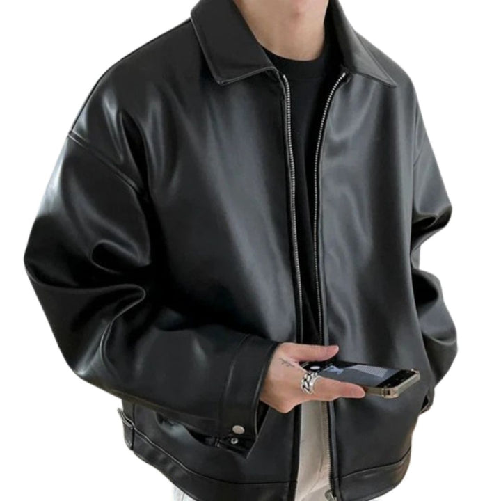 Men's oversized streetwear bomber jacket in black, featuring a full zip and ribbed cuffs. Urban fashion outerwear.