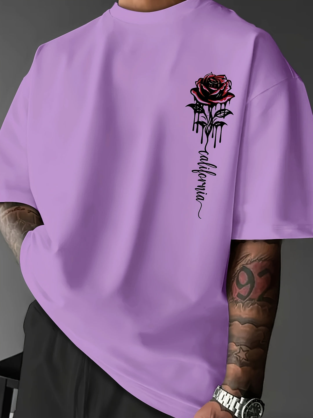 White men's loose fit t-shirt featuring a striking rose print. Perfect for urban streetwear style.