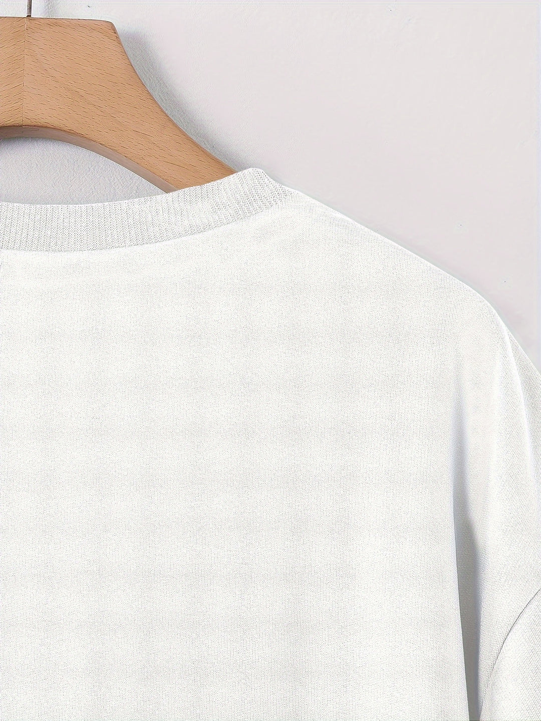 Comfortable men's graphic t-shirt with a vibrant rose print. Loose fit for relaxed urban style.