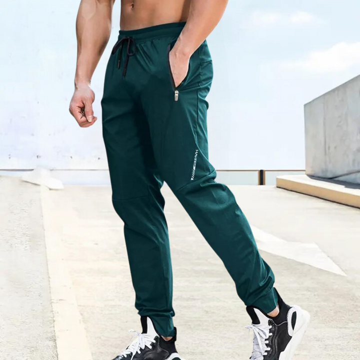 Lightweight men's athletic training trousers, perfect for running & gym. Comfortable and flexible activewear performance joggers.