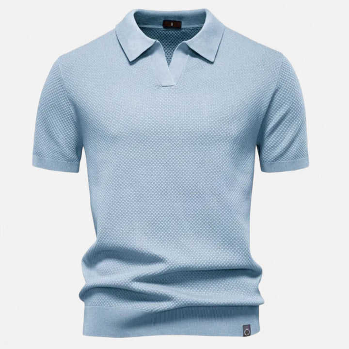 Vibrant pineapple pattern on a men's polo shirt, short sleeve design for comfortable, stylish summer fashion.