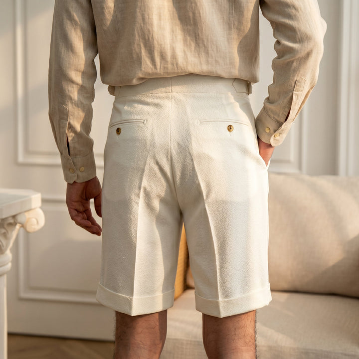 Tailored men's Gurkha shorts with front pleats, offering a relaxed fit for smart casual wear and summer style.