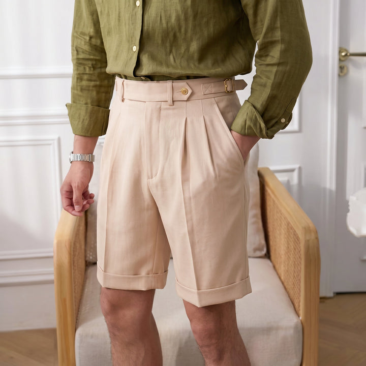 Refined men's pleated shorts, a versatile Gurkha style for smart casual outfits and sophisticated summer wear.