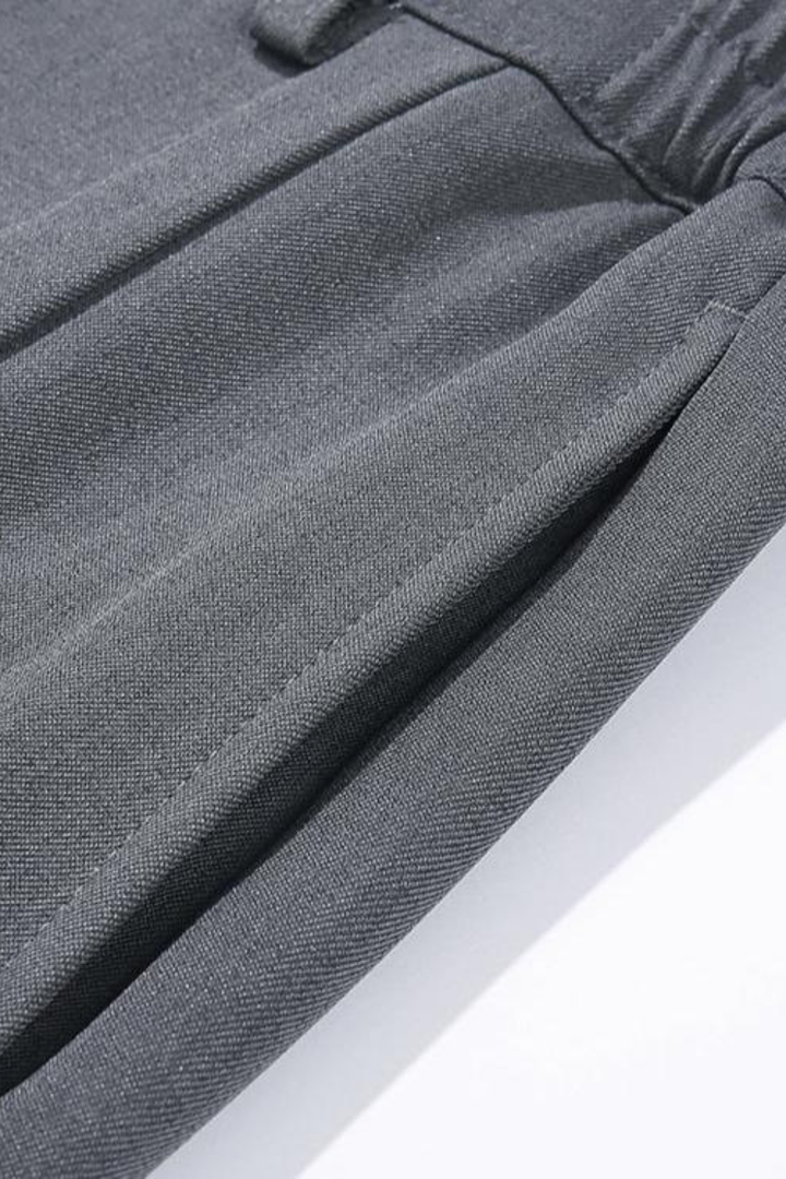 Elegant men's pleated wide leg tailored trousers, offering a comfortable and stylish smart casual look.