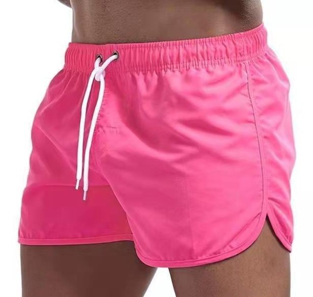 Lightweight quick-dry men's swim trunks with elastic waist, ideal for pool and beach activities.