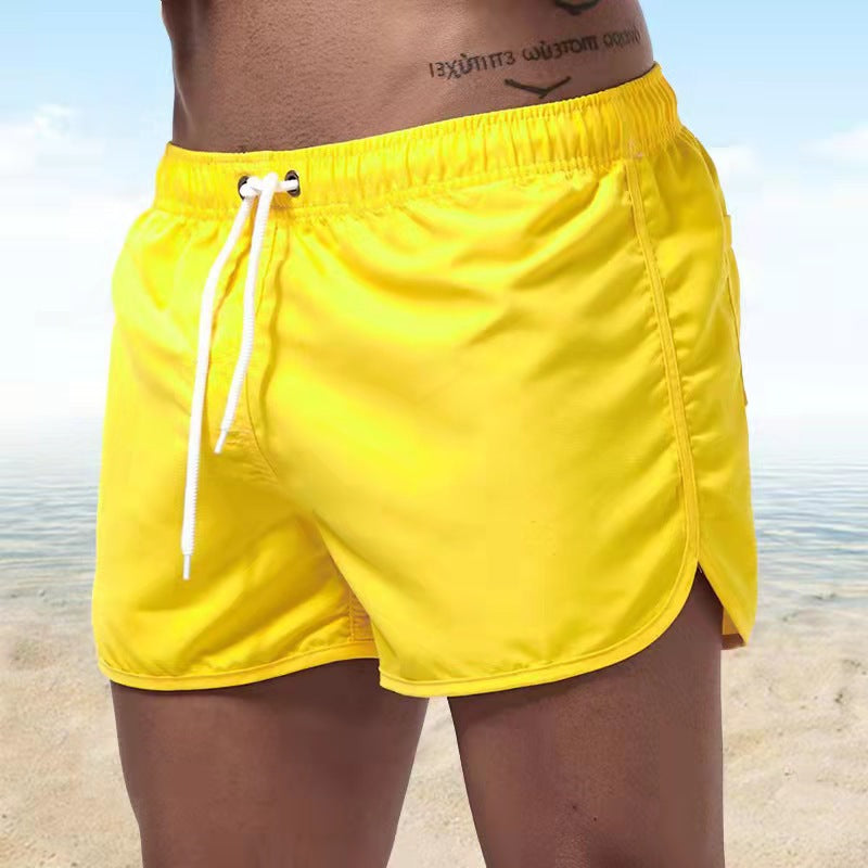 Stylish men's elastic waist swim trunks, quick-dry & adjustable, perfect for summer beachwear.