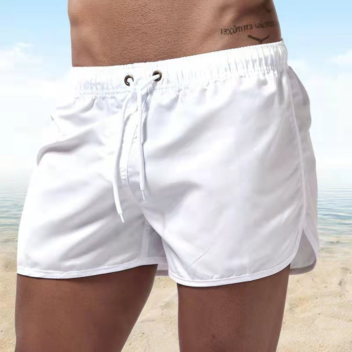 Versatile men's quick-dry swim trunks with elastic waist, great for beach, pool, and casual summer outings.