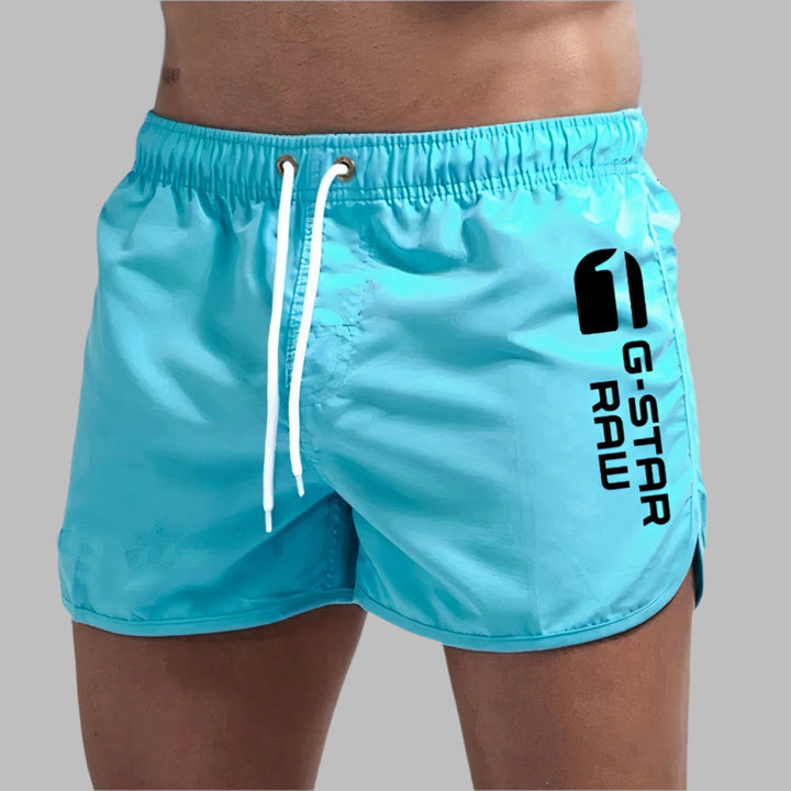 Men's quick-dry swim trunks, perfect for beach, pool, and summer water sports. Comfortable and durable swimwear.