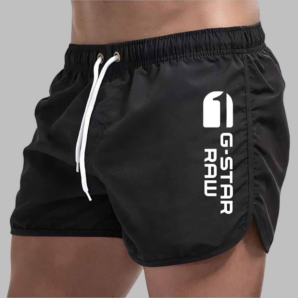 Athletic men's quick-dry swim trunks. Lightweight, solid color beach shorts ideal for swimming & casual summer wear.