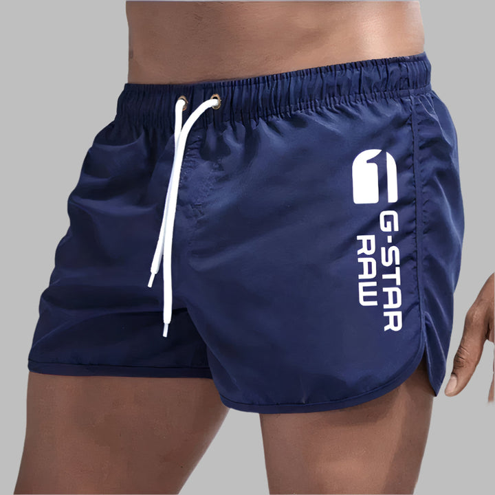 Quick-dry men's swim trunks for ultimate comfort. Essential beach shorts & pool swimwear for active summer days.