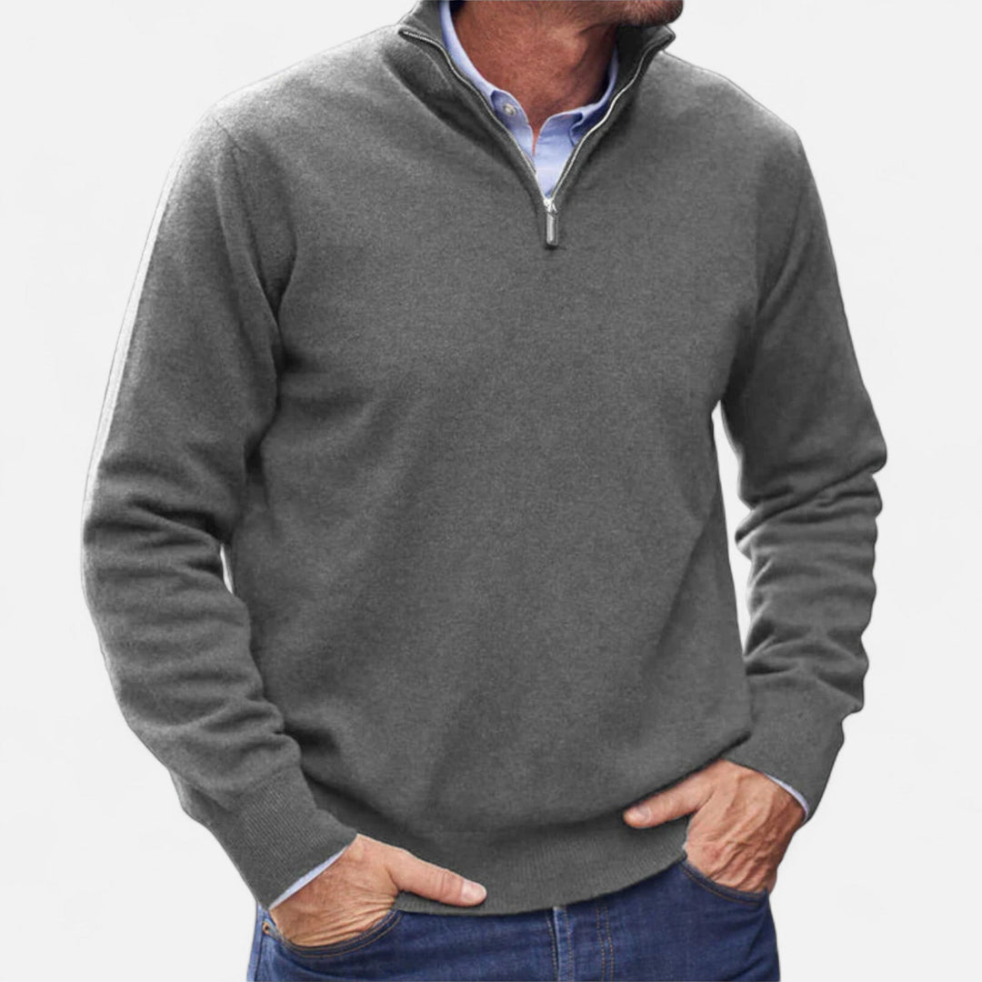 Full shot of a man wearing a versatile zipper sweater, a smart casual layering piece for men.