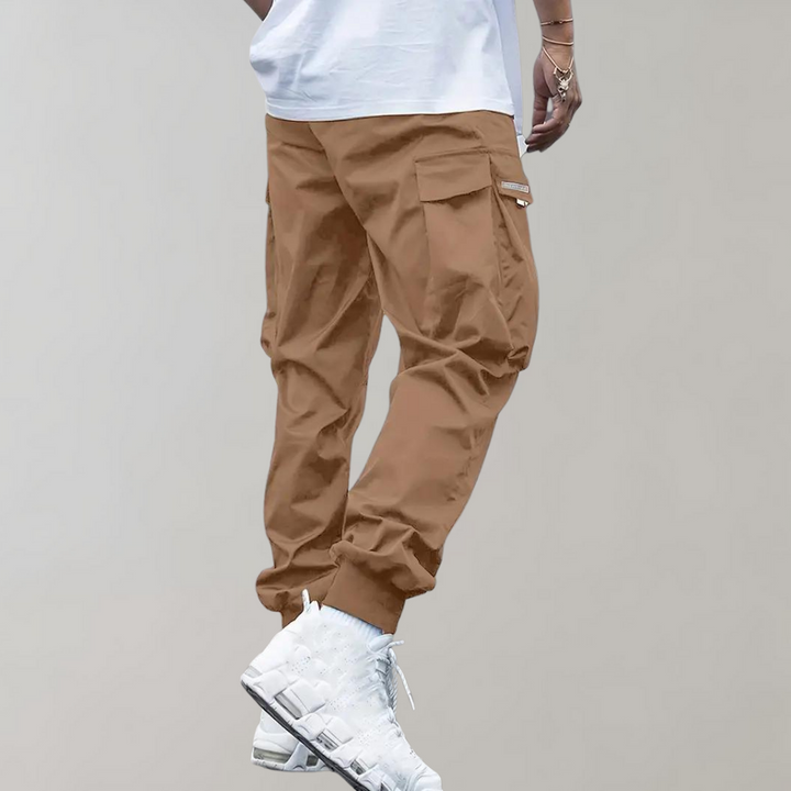 Black men's casual cargo trousers, relaxed fit with a functional drawstring waist, ideal for utility wear.