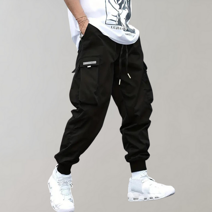 Men's relaxed fit cargo trousers with an elastic drawstring waist and practical side pockets.